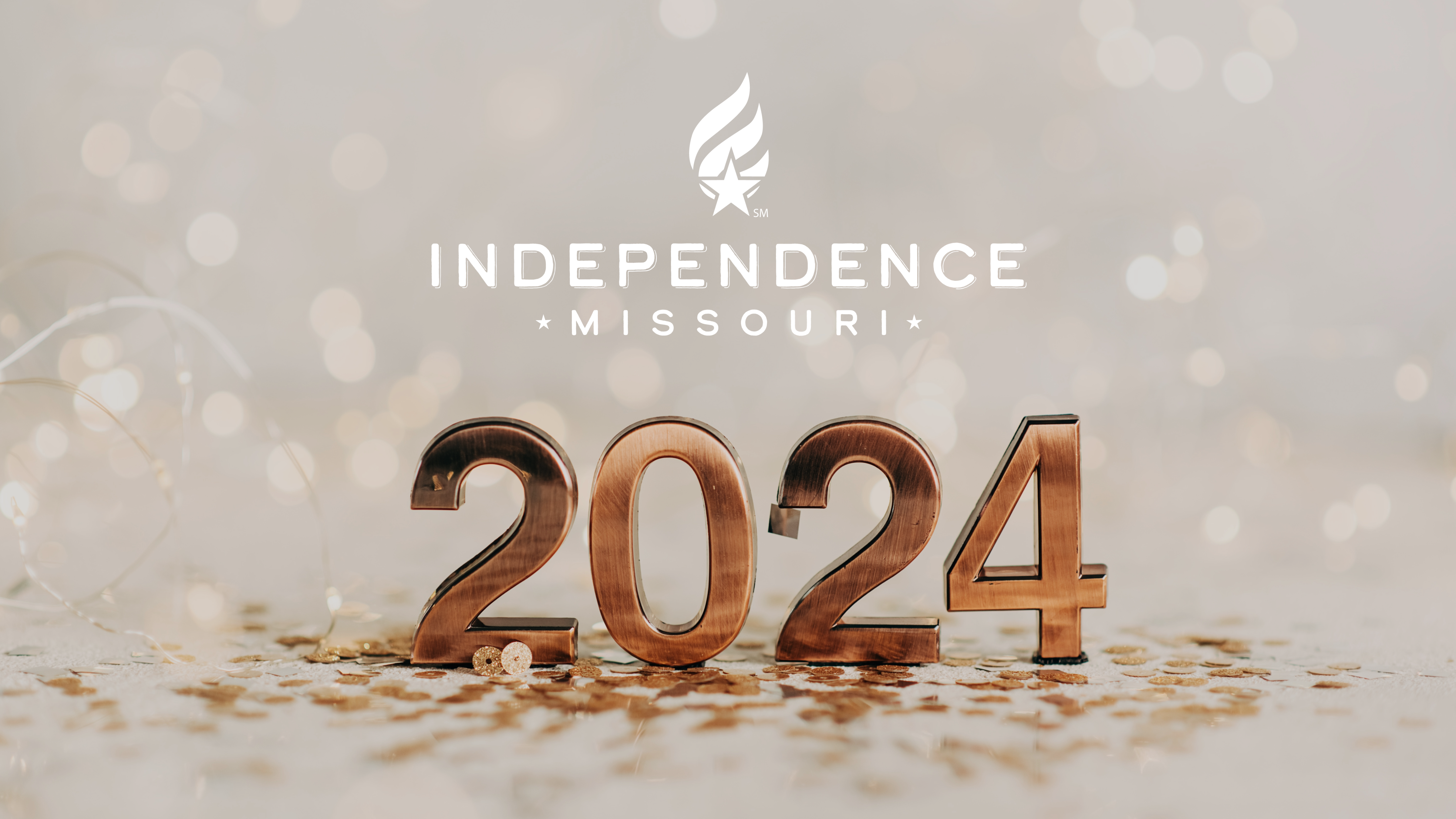 Image of 2024 in gold with confetti and lights in the background. The Independence logo is white above 2024.