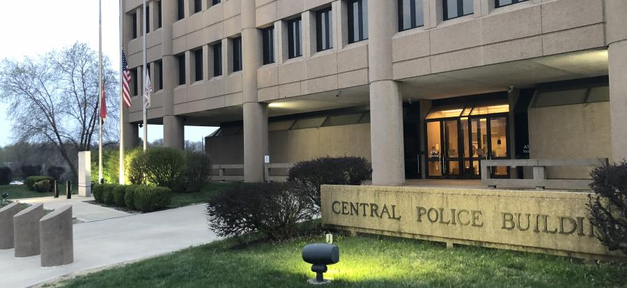 Lights shine on the front of the Central Police Building also known as Independence Police Headquarters in the early morning hours.