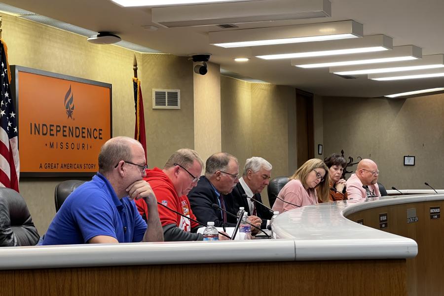 Members of the council sit at the dais in the Council Chambers of City Hall.