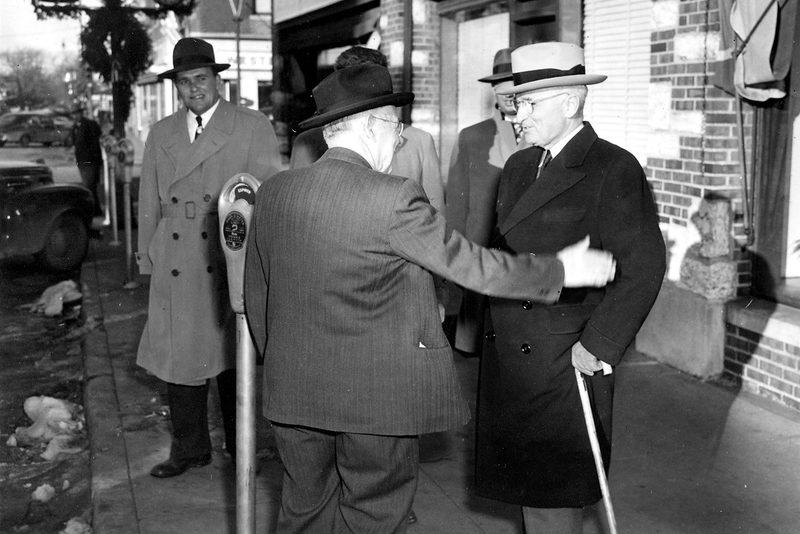 Harry Truman chatting with reporters on Historic Independence Square. 