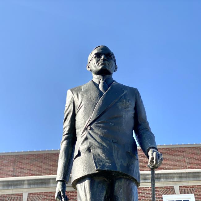 Looking up at the statue of President Truman walking with his cane on the east side of the Historic Truman Courthouse in Independence, Mo.